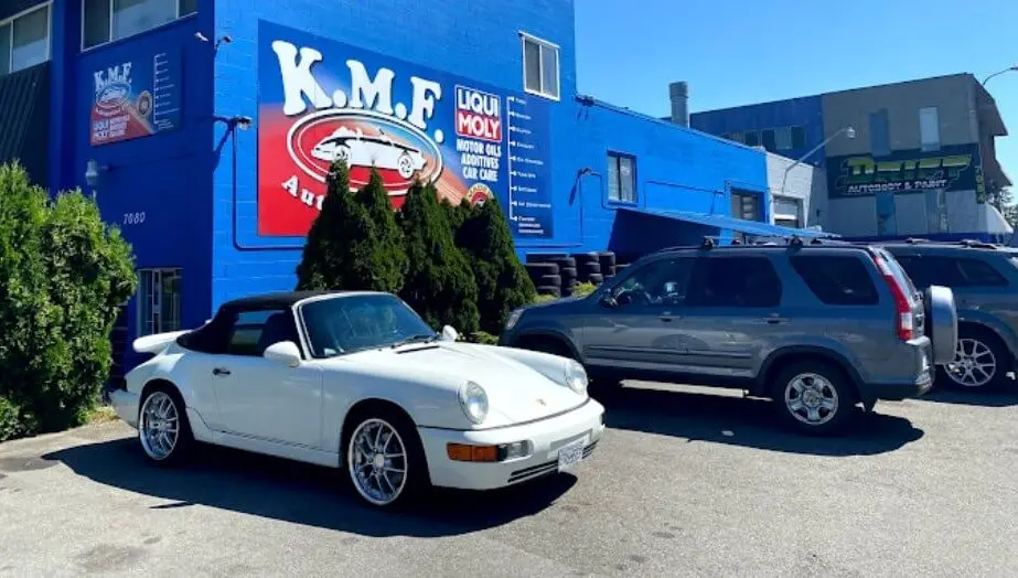 KMF Automotive shop front at 7080 Macpherson Ave, Burnaby, with a white Porsche 911 cabriolet